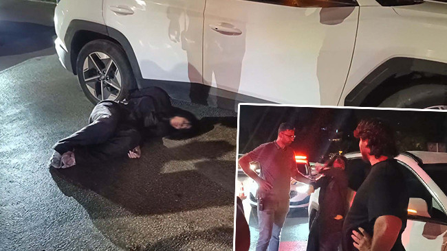 Otomobiliyle ters yöne girince yakalandı: Polise direnip, gazetecilere tükürdü